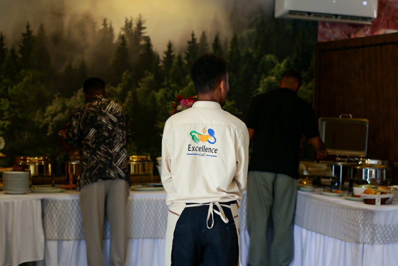 Excellence Café — Staff at buffet line